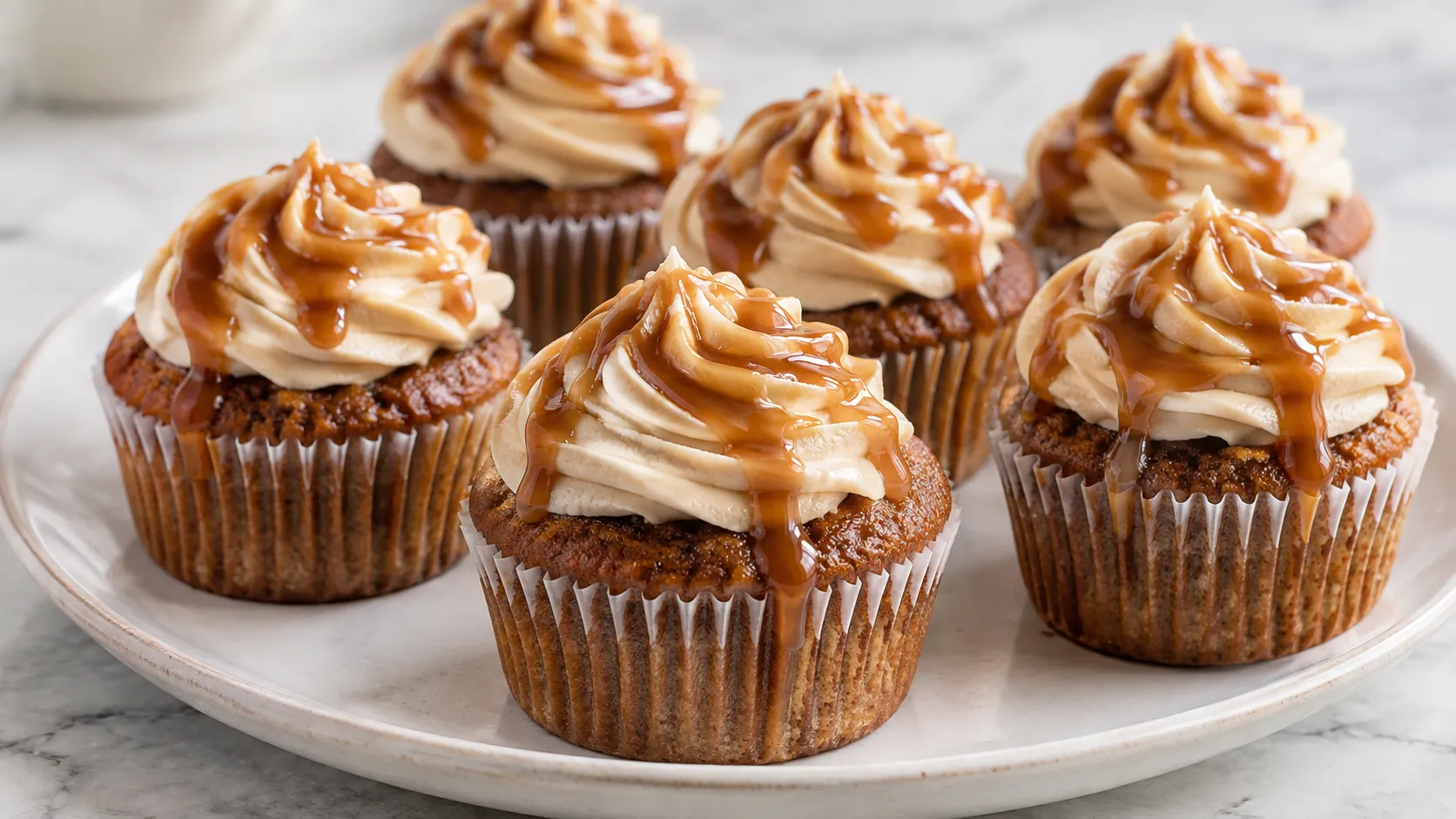 Mary Berry Sticky Toffee Cupcakes with buttercream and toffee sauce drizzle